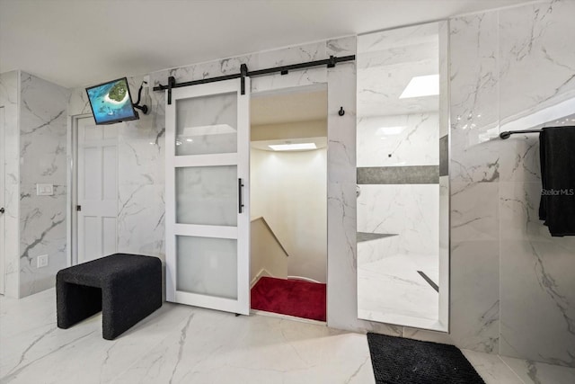18 Winston Dr, Belleair, FL 33756 - bathroom with a marble finish shower, marble tiled flooring, and stone wall
