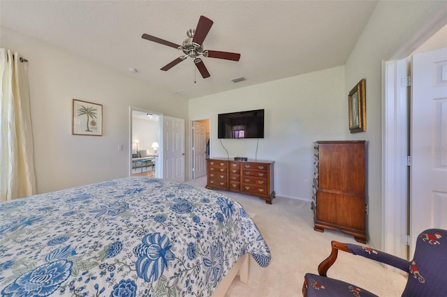 bedroom with ceiling fan and light carpet