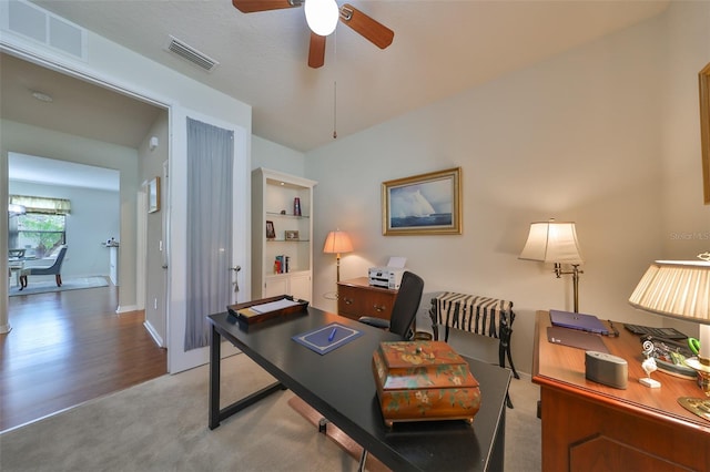 office space with ceiling fan and hardwood / wood-style floors