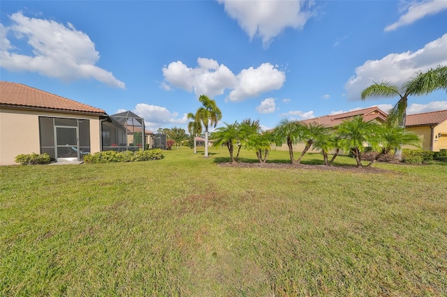 view of yard with a lanai