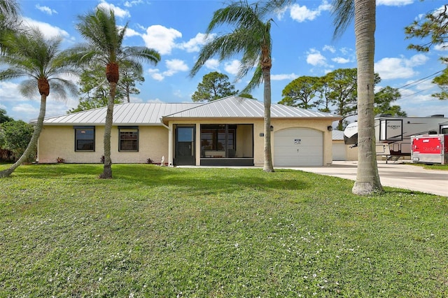 single story home with a front lawn and a garage