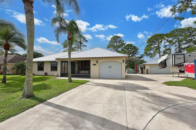 ranch-style home with a carport, a garage, and a front yard