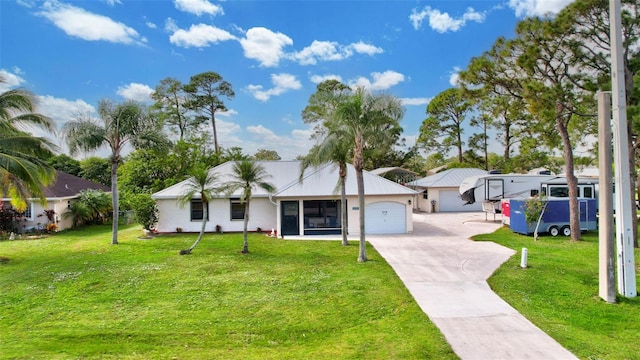 ranch-style house featuring a garage and a front yard