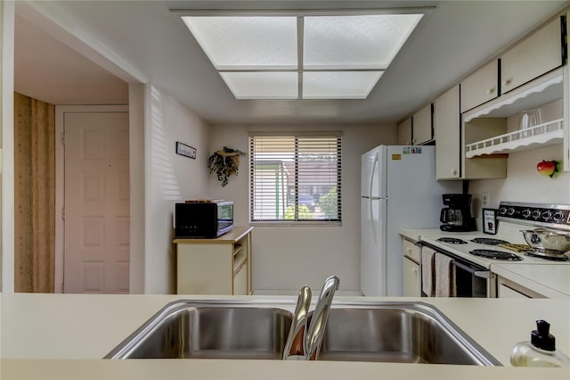 kitchen with white appliances and sink