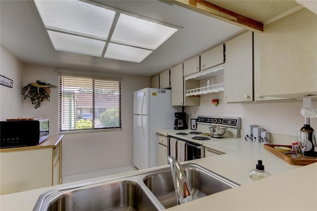 kitchen featuring white appliances and sink