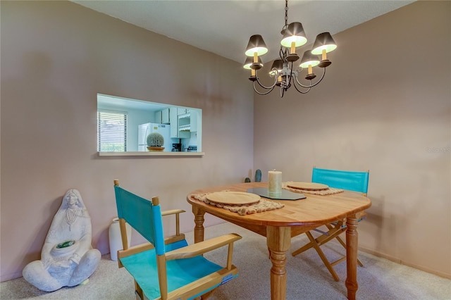 carpeted dining area with a notable chandelier