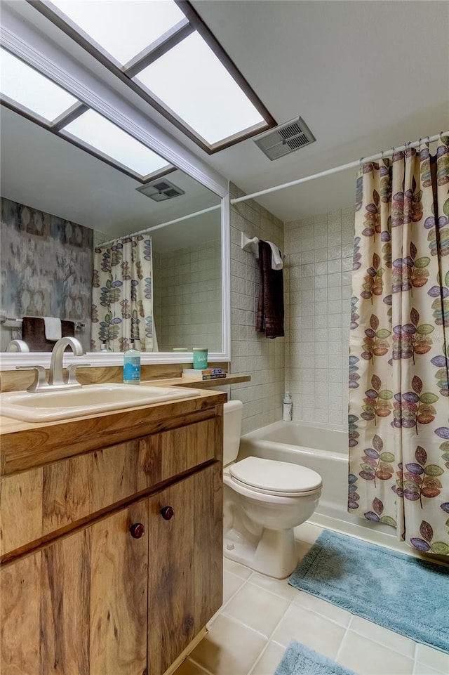 full bathroom with tile patterned flooring, shower / bath combo, toilet, and vanity