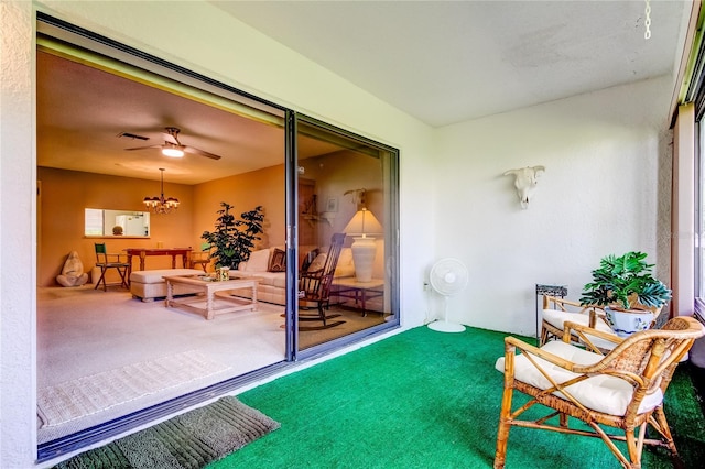 sunroom with ceiling fan