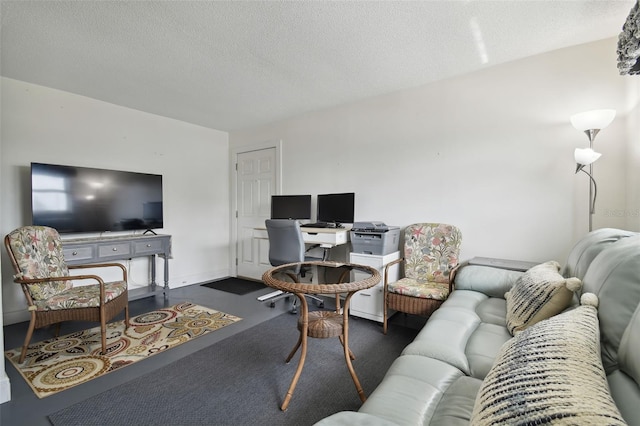 carpeted living room featuring a textured ceiling