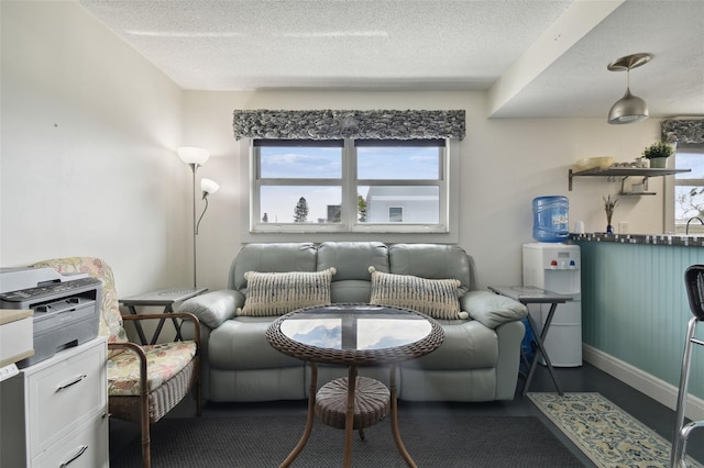 sitting room featuring a textured ceiling