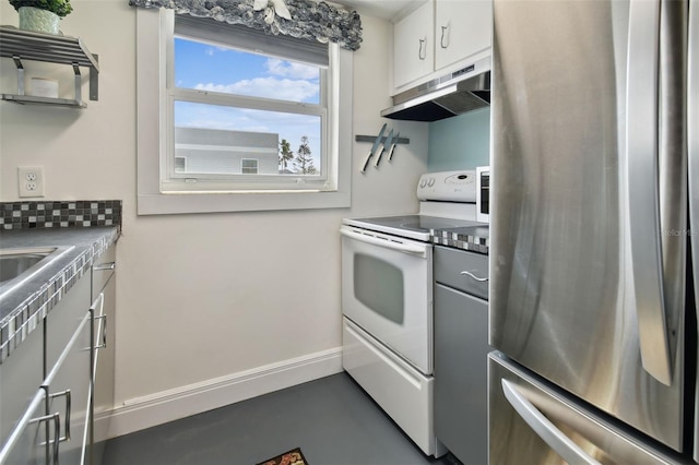 kitchen with white cabinets, stainless steel fridge, and white range with electric stovetop