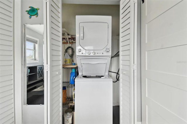 washroom with stacked washer and dryer