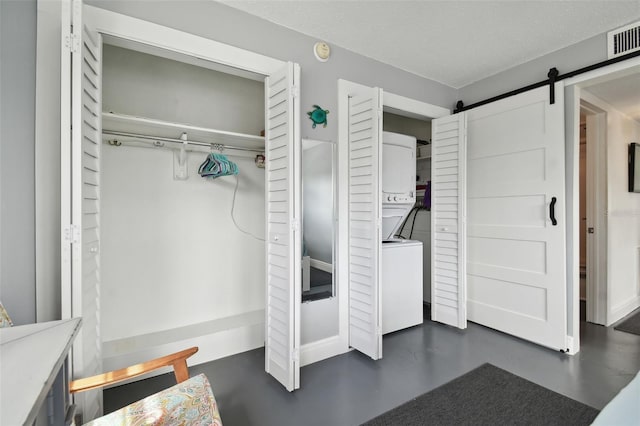 closet with stacked washer / drying machine