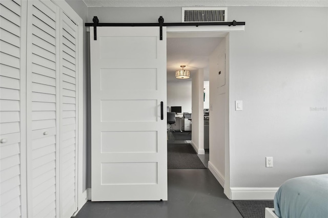 hall featuring a barn door