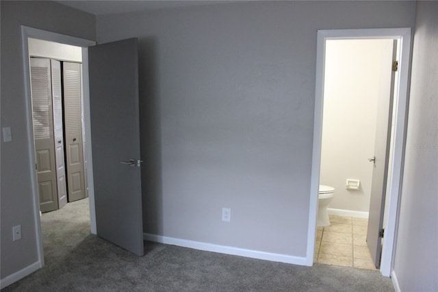 carpeted bedroom featuring a closet