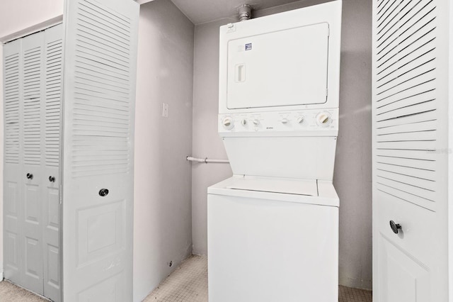 washroom with laundry area and stacked washing maching and dryer