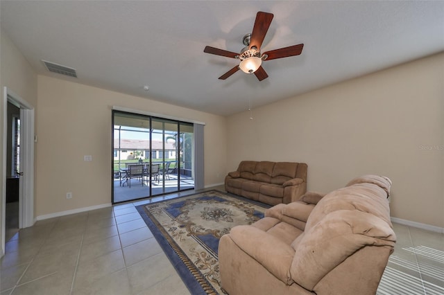 tiled living room with ceiling fan