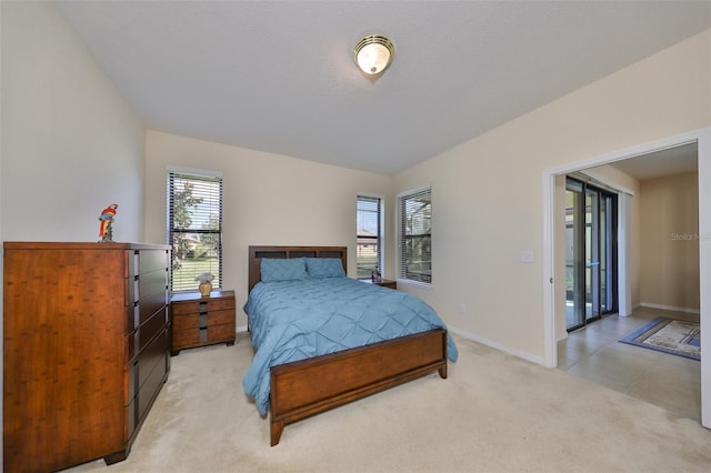 bedroom with light colored carpet