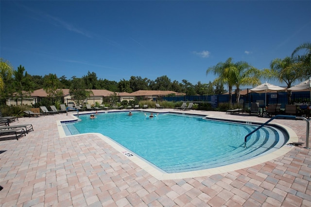 view of swimming pool featuring a patio area