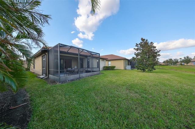 5721 Sunset Falls Dr, Apollo Beach, FL 33572 - back of house with a lawn and glass enclosure