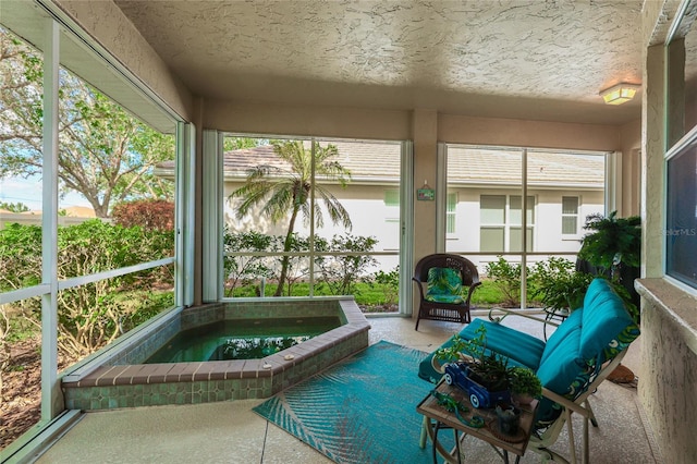 unfurnished sunroom featuring a jacuzzi and a wealth of natural light