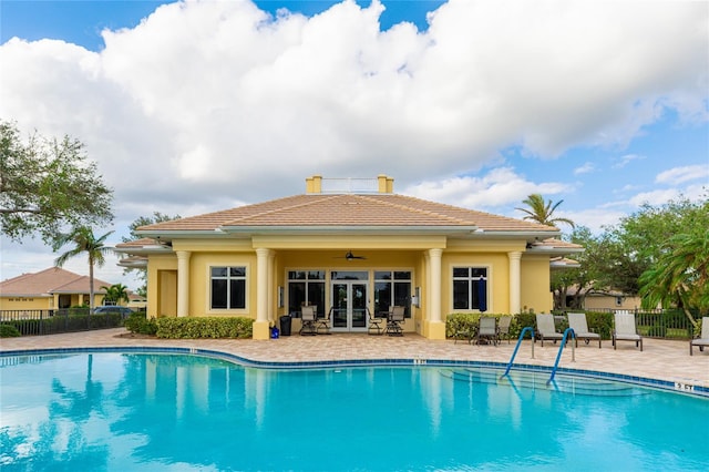 view of swimming pool featuring a patio and ceiling fan