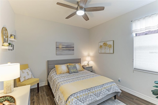 bedroom featuring dark hardwood / wood-style floors and ceiling fan