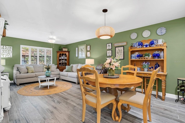 dining area with light hardwood / wood-style floors