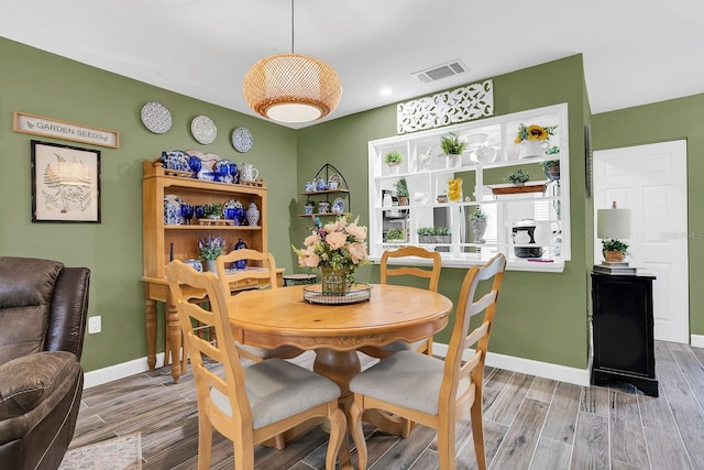 dining room featuring hardwood / wood-style flooring