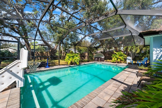 view of pool with a lanai and a patio area