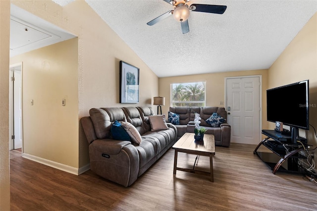 living room featuring hardwood / wood-style floors, ceiling fan, lofted ceiling, and a textured ceiling