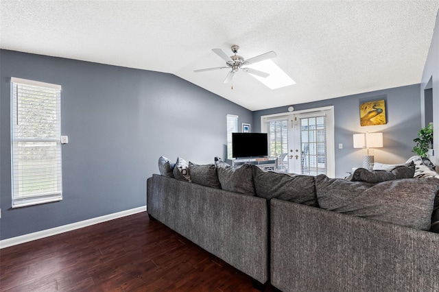 living room featuring a textured ceiling, ceiling fan, lofted ceiling, and dark wood-type flooring