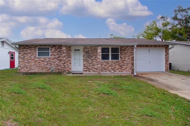 ranch-style house with a garage and a front lawn