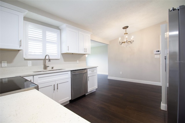 kitchen with white cabinetry, dishwasher, pendant lighting, and dark hardwood / wood-style floors