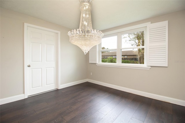 unfurnished dining area featuring a notable chandelier and dark hardwood / wood-style flooring