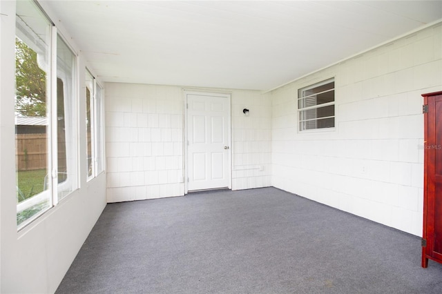 unfurnished sunroom with a wealth of natural light