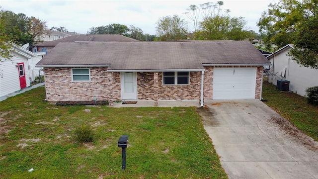 ranch-style home featuring a garage and a front lawn