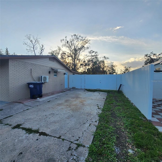 yard at dusk with a patio