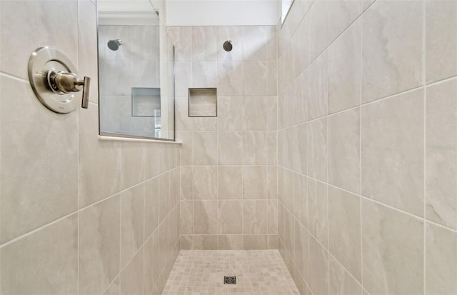 bathroom featuring tiled shower