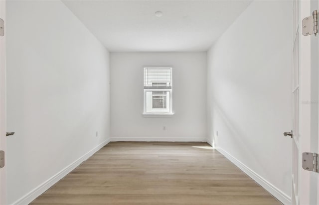 unfurnished room featuring light hardwood / wood-style floors