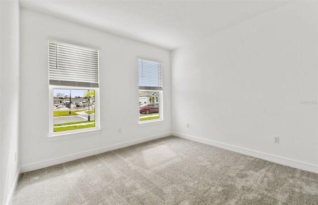 empty room with carpet flooring