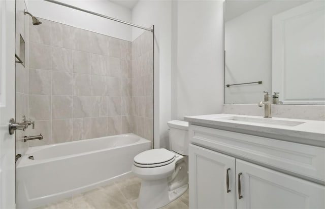 full bathroom with tiled shower / bath combo, vanity, tile patterned floors, and toilet