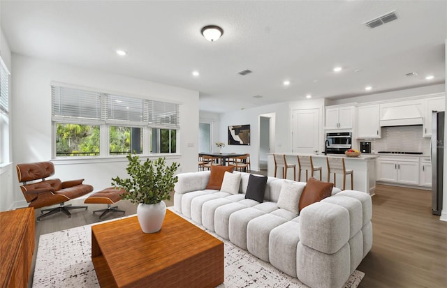 living room with light hardwood / wood-style floors