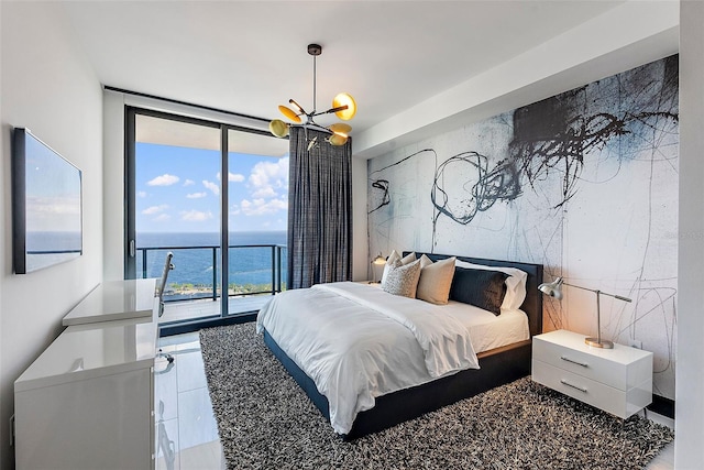 bedroom featuring a chandelier, floor to ceiling windows, access to outside, and multiple windows