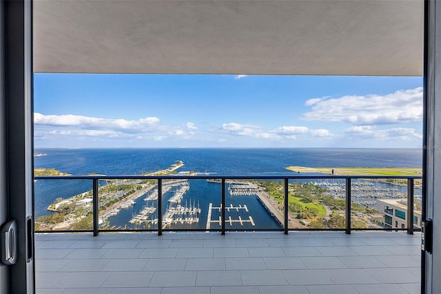 balcony featuring a water view