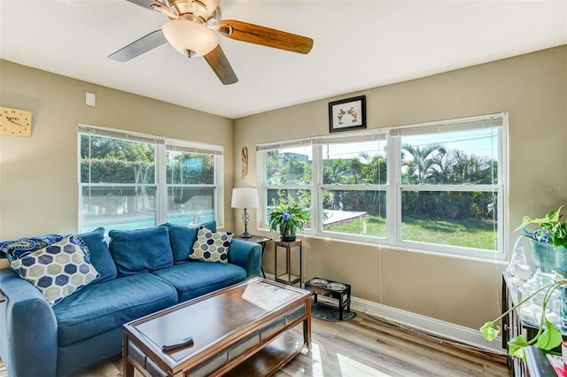 sunroom / solarium featuring ceiling fan