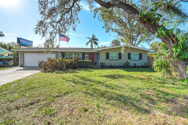 ranch-style house featuring a garage and a front yard