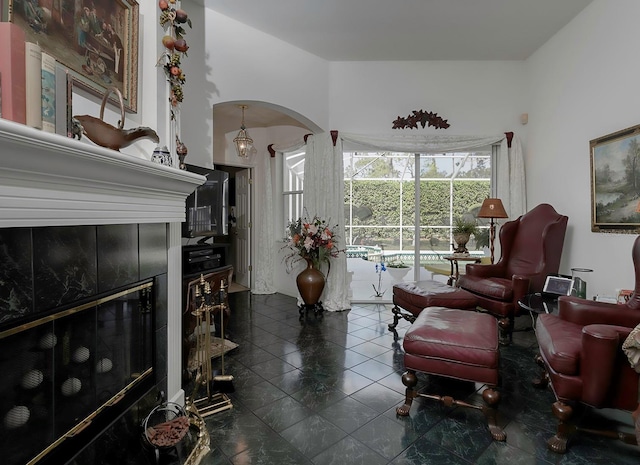 living room featuring a tile fireplace