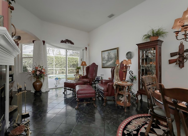 sitting room featuring dark tile patterned flooring