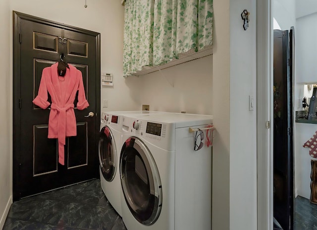 laundry area featuring washing machine and clothes dryer